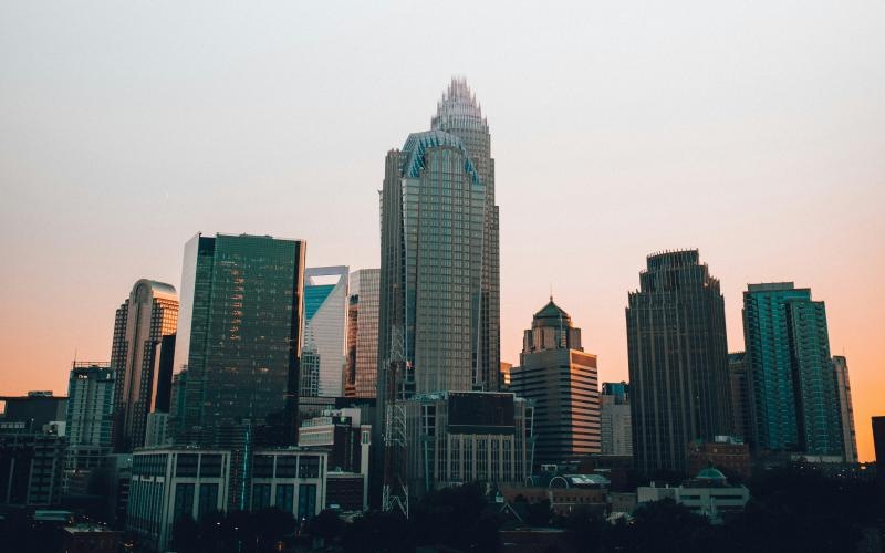 a city skyline with tall buildings